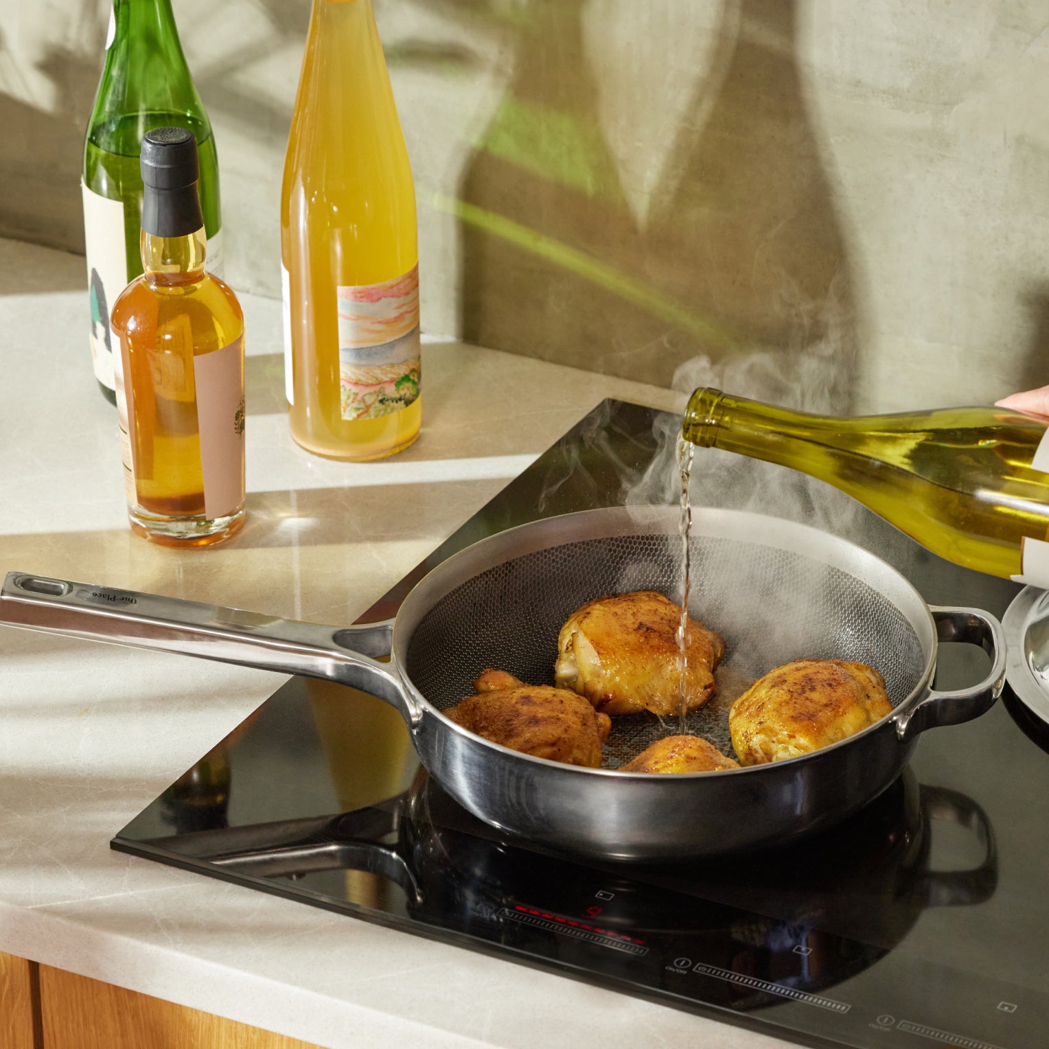 Titanium Always Pan Pro 10.5″ in use on a stovetop